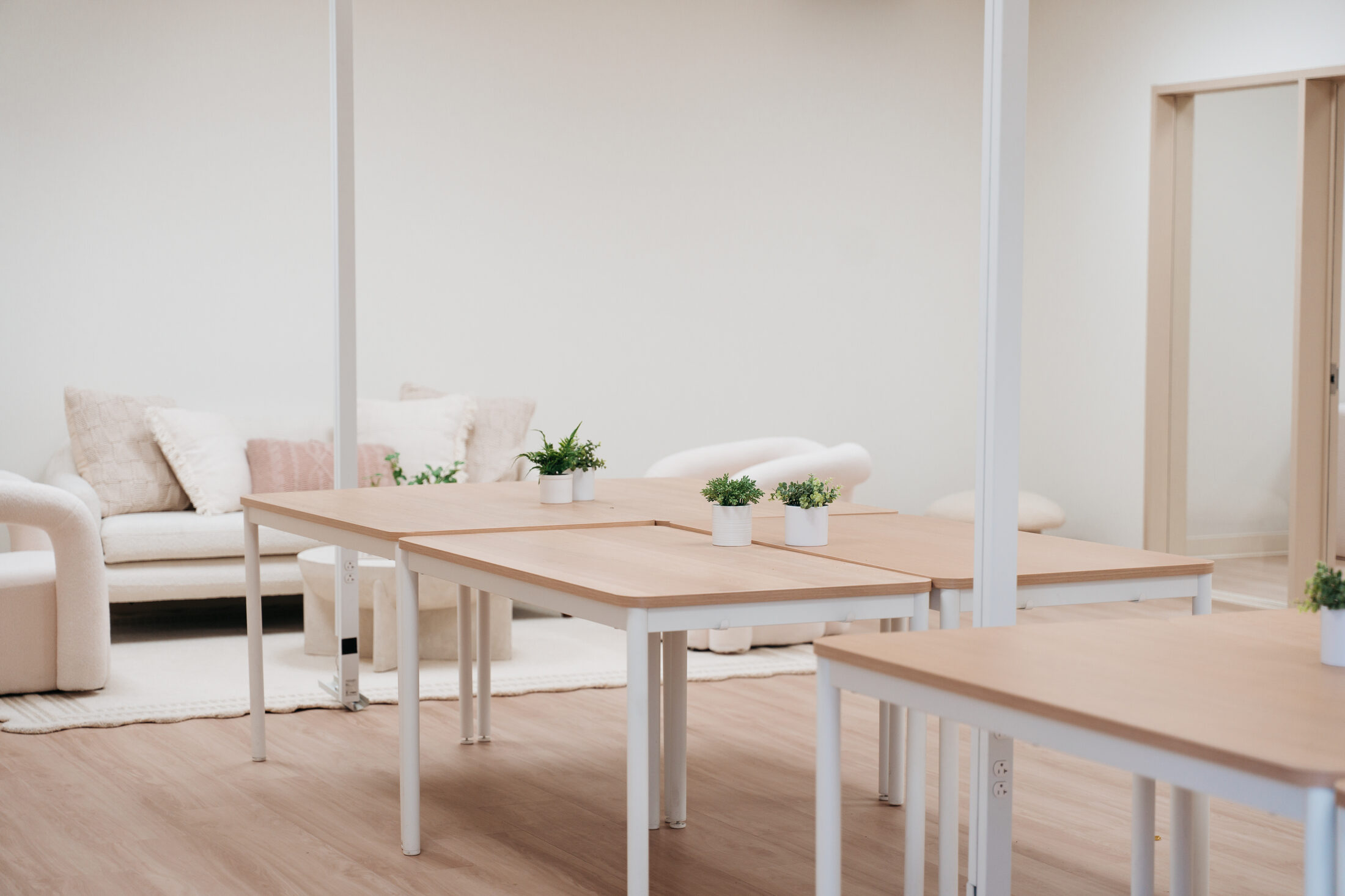 Lounge tables at the finished Élan Beauté space