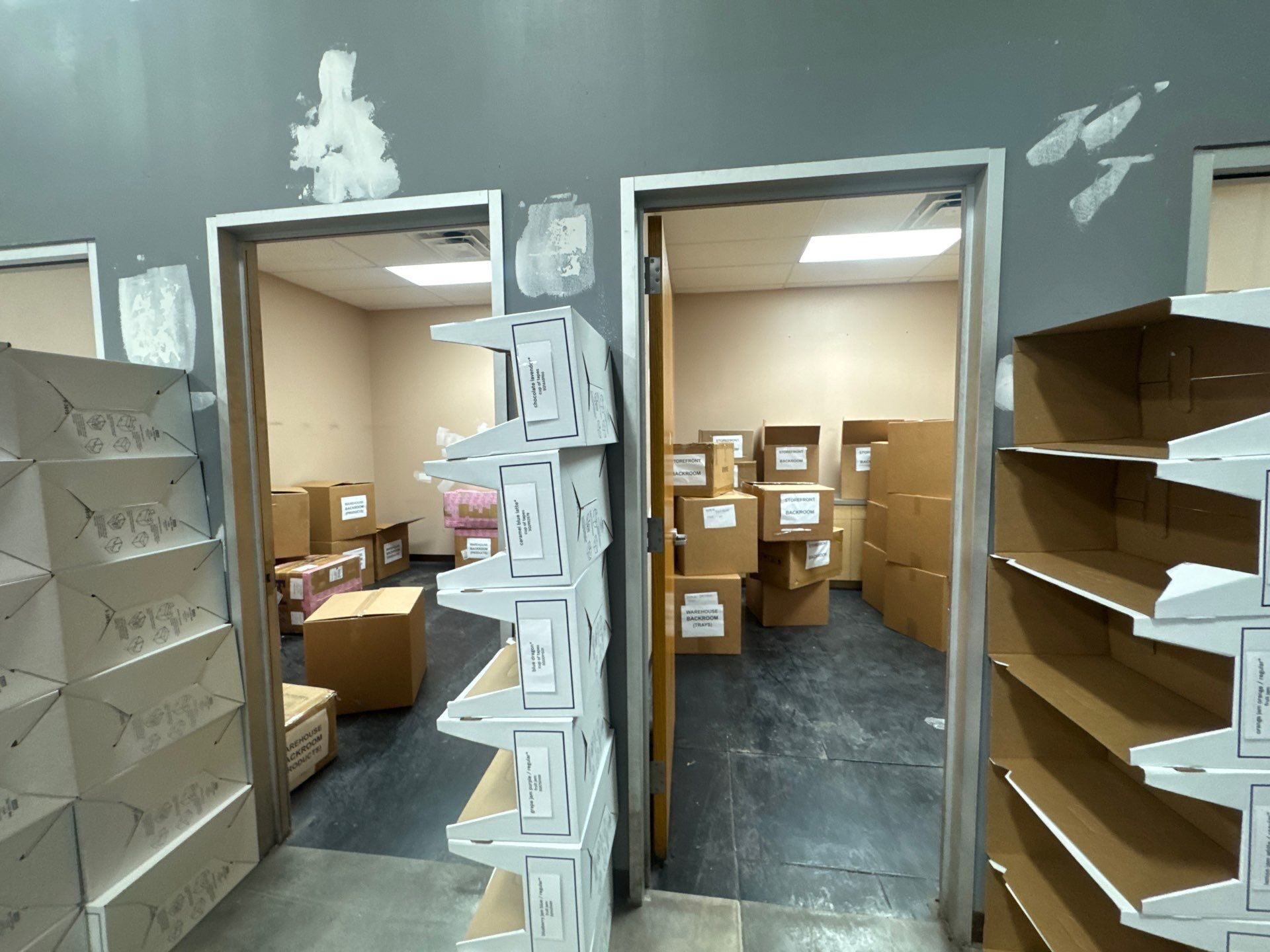 Storage area filled with boxes before the Élan Beauté renovation