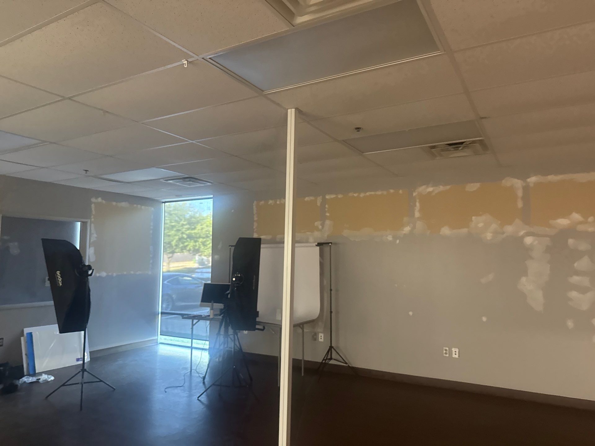 Office space with patched drywall before the Élan Beauté renovation