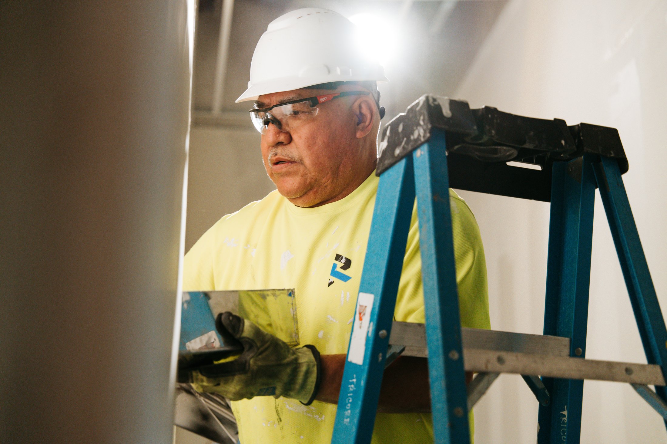 Resolver Commercial Services technician working on a commercial interior